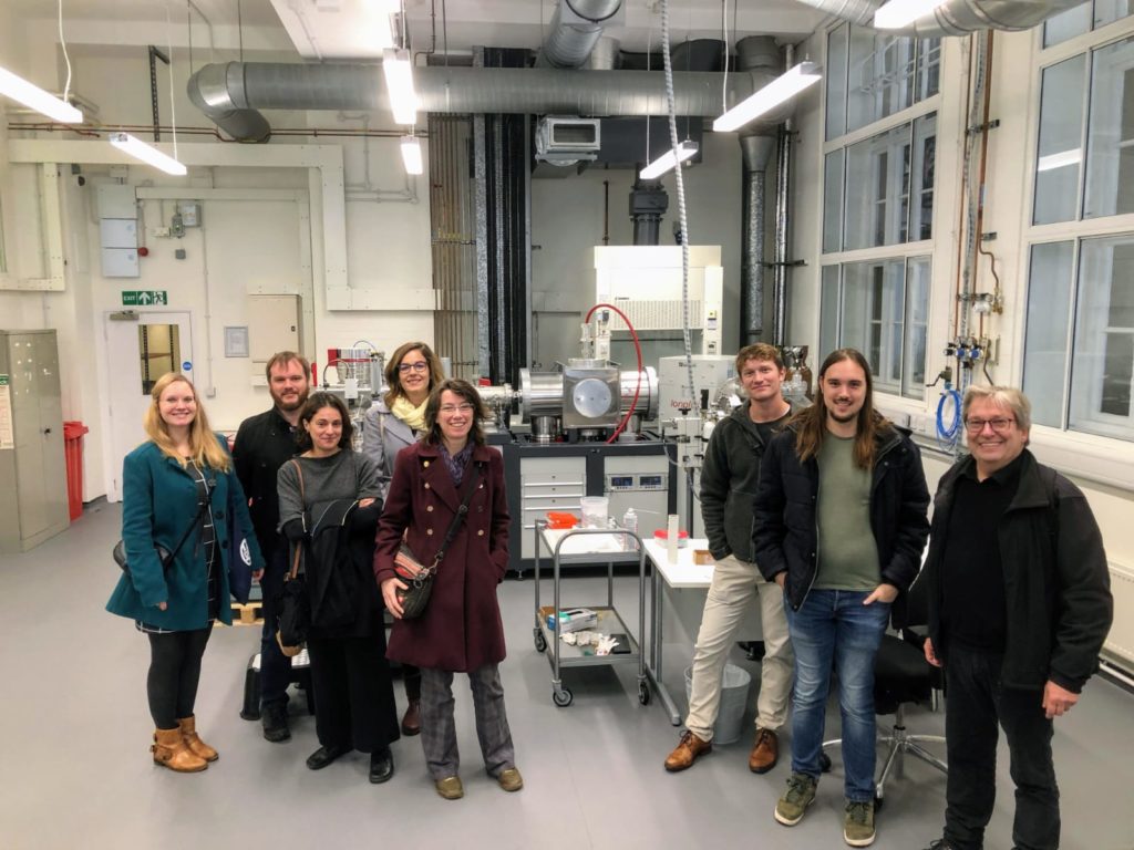 Rural Riches team posing with the Oxford Radiocarbon Accelerator Unit of the Research Laboratory for Archaeology and the History of Art (RLAHA)